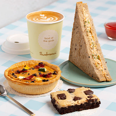 Choice of 2 Veg Sandwiches/Savouries + Beverage + Eggless Brownie